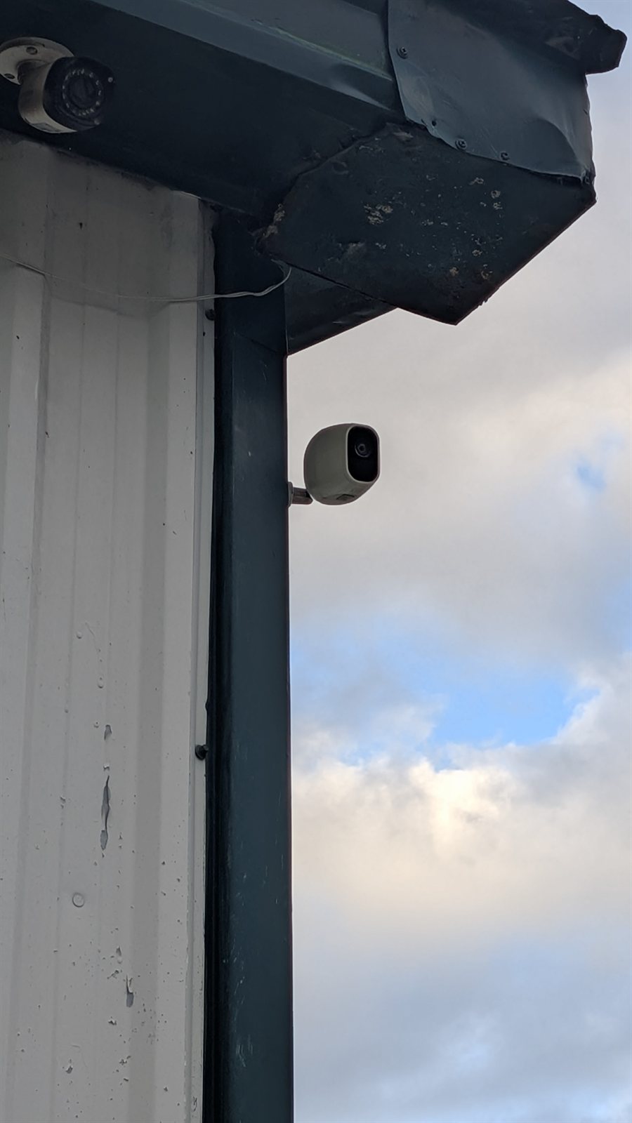 Outdoor security camera mounted on the corner of the Moro Storage building